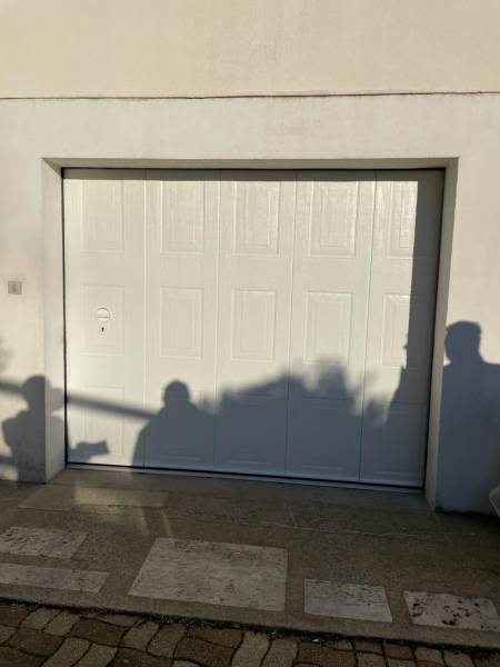 Quelle entreprise pour la pose d'une porte de garage manuelle avec portillon intégré à Petit-Couronne 76 